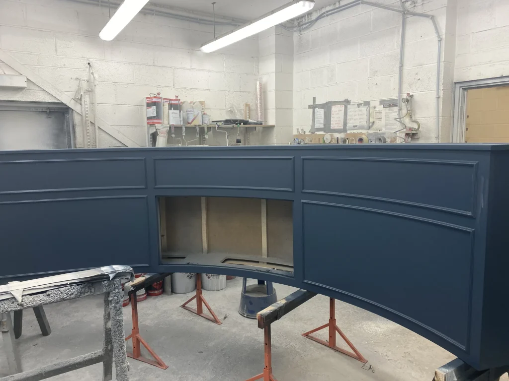 The navy panelled bar front being made in the Carve Interiors workshop