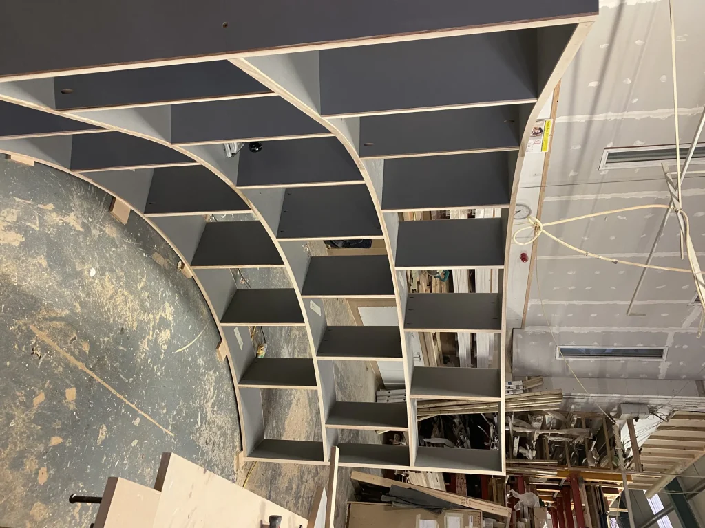 Curved display shelving being built in the workshop