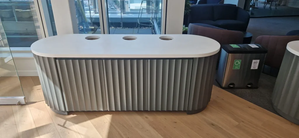 Rounded island with a solid surface top and fluted front
