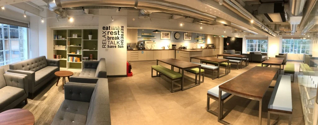 Panoramic view of the staff kitchen, shelving and bench seating at Vets4Pets Swindon